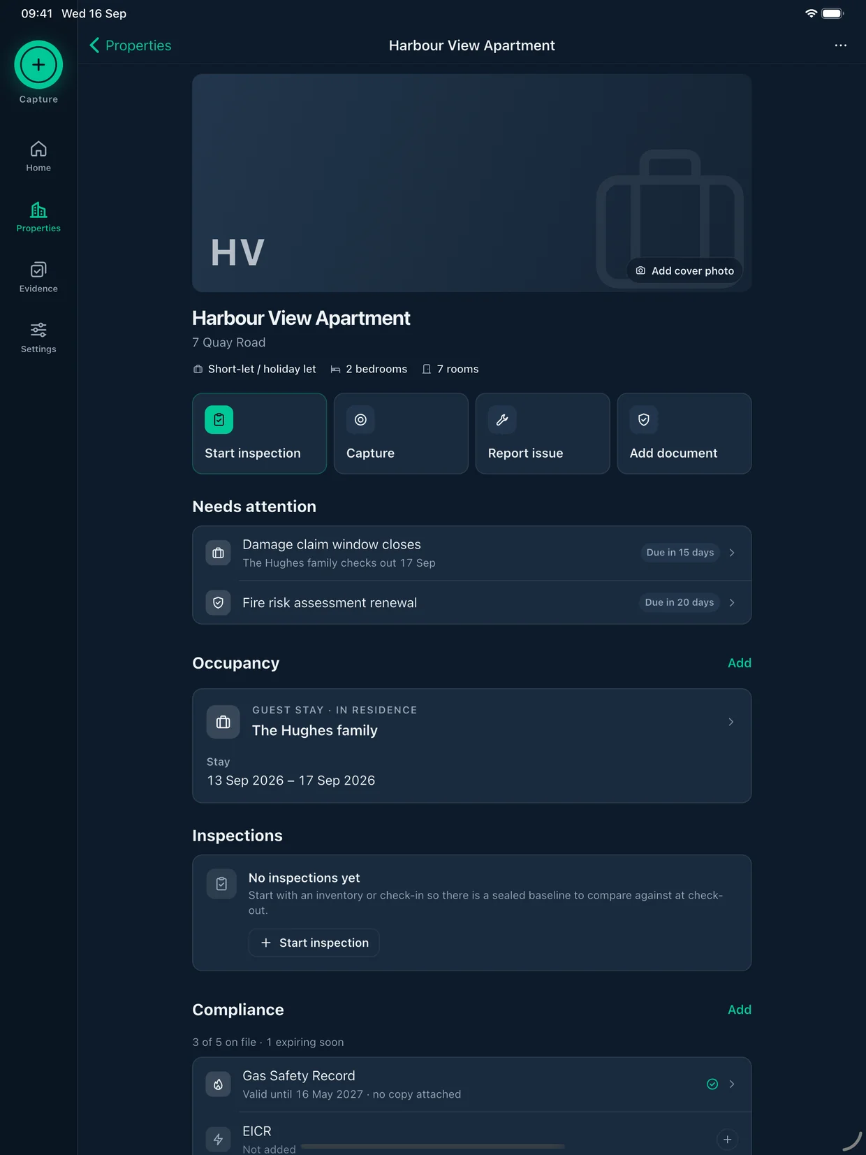 A holiday let, Harbour View Apartment, on iPad: the damage claim window and a fire risk assessment renewal need attention, a guest stay is in residence, and Gas Safety and EICR are listed under compliance.