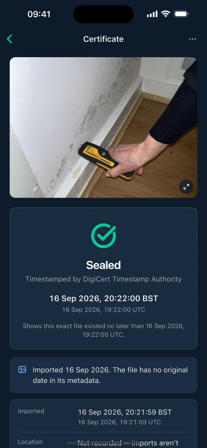 A real Witnessed certificate for a photo of damp and mould above a skirting board being checked with a moisture meter, sealed by the DigiCert Timestamp Authority on 16 September 2026 and marked as imported.